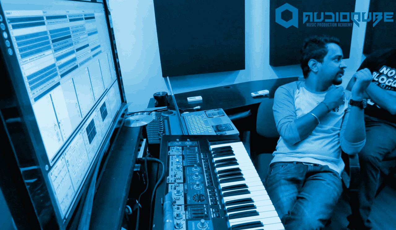 Sound Avtar at a production workstation with a synthesizer during his masterclass